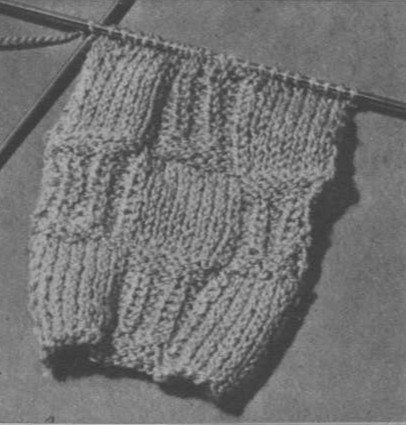Damespullover in twee kleuren en blokjesmotief